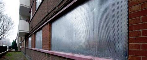 house boarded up with metal|plywood board up for vacant property.